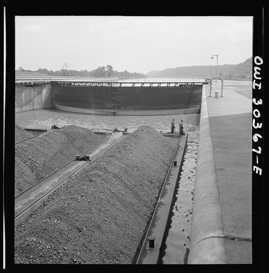 Coal barges going through lock