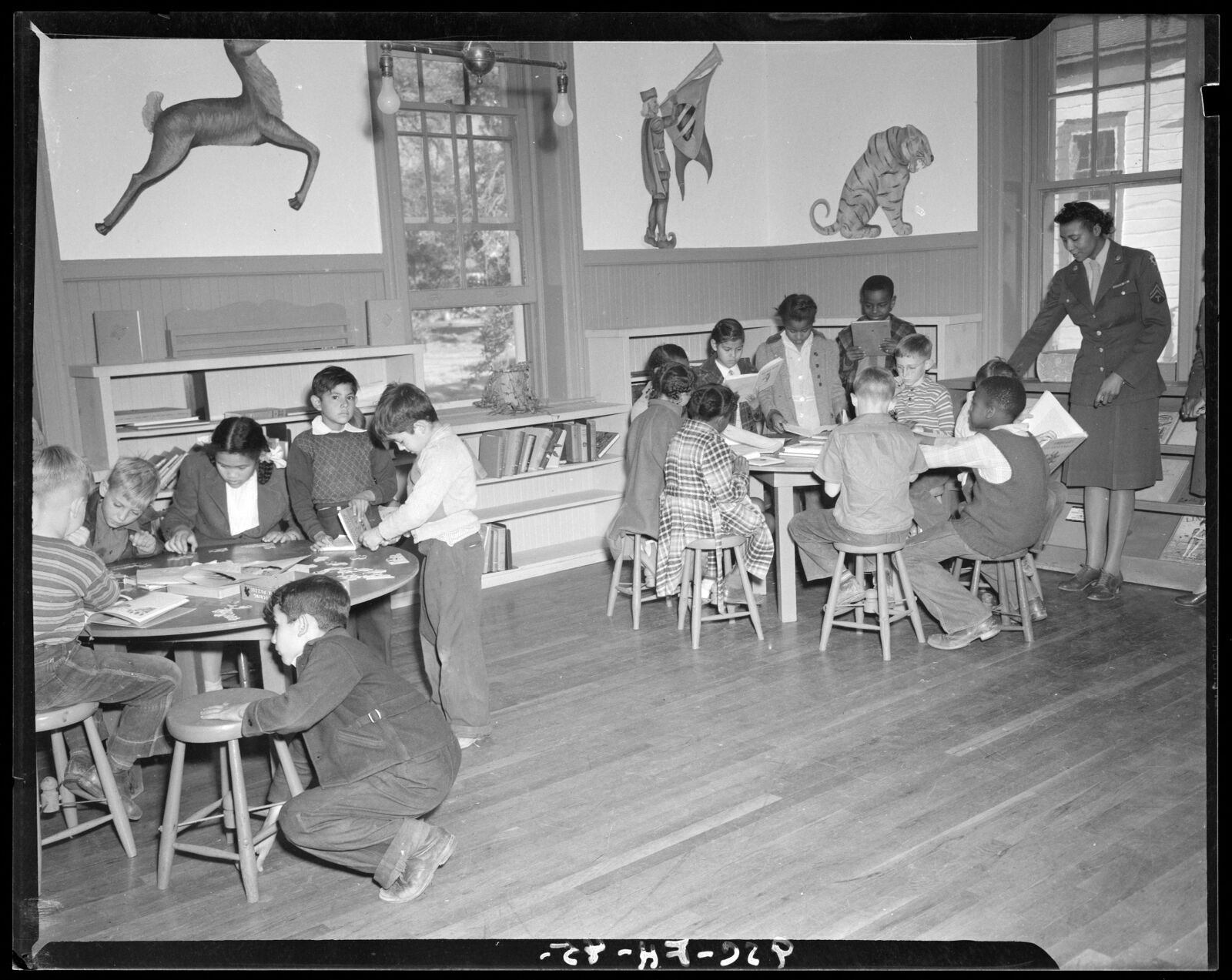 Children reading and playing, Boston Public Library - undated