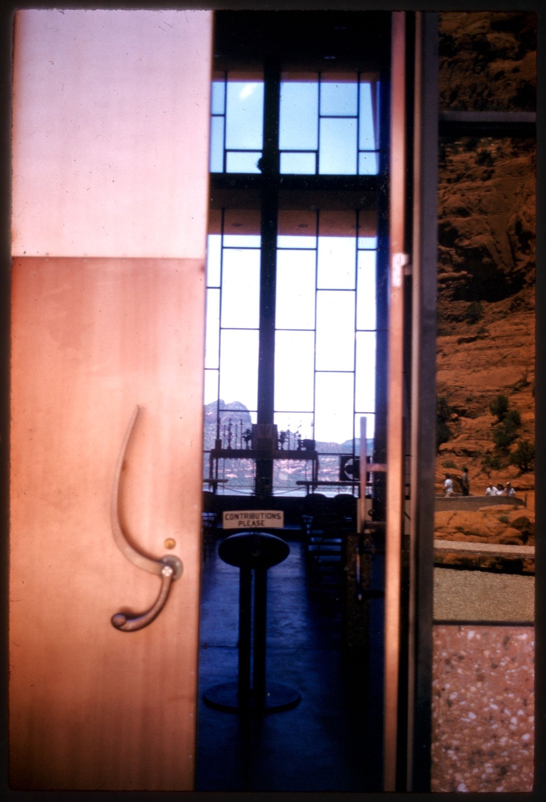View through sliding door into room with tall window, Boston Public Library - undated