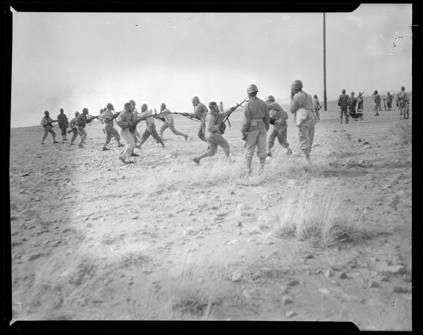 Soldiers wearing gas masks training with rifles and bayonets, Boston Public Library - undated
