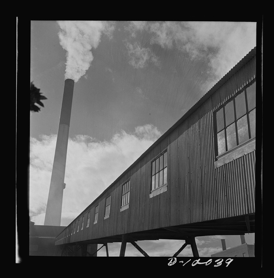 Production. Copper. Conveyor gallery and smokestack at a copper smelter of the Phelps-Dodge Mining Company, Morenci, Arizona. This plant supplies great quantities of the copper so vital in our war effort