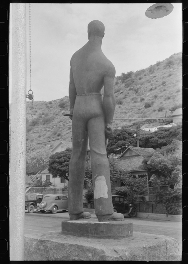 Miners monument in Bisbee, Arizona. This monument is cast in cement, sprayed with molten copper and mounted on a block of Colorado granite used for miners' drilling contests in the nineties. The monument was erected in 1935