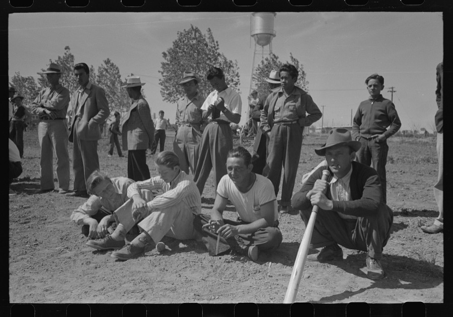 Watching baseball game at the annual field day at the FSA (Farm Security Administration) farmworkers community, Yuma, Arizona