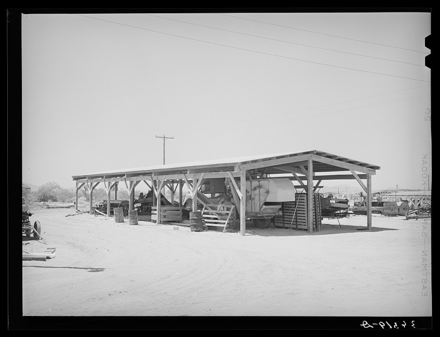 Shelter for farm machinery at the Casa Grande Valley Farms. Pinal County, Arizona