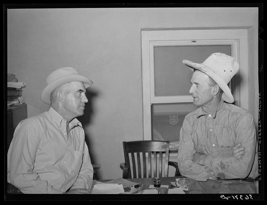 Casa Grande Valley Farms' manager on left talking with a member of the cooperative. Pinal County, Arizona
