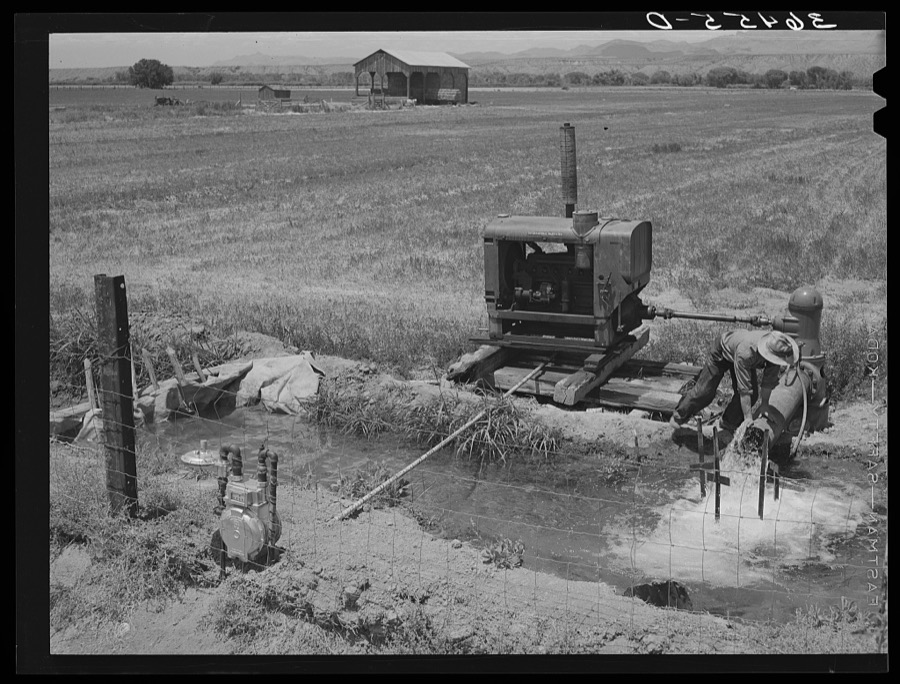 Water for irrigation is pumped in farming section of Solomonsville, Arizona. Crops here are cotton, alfalfa, corn and small grains