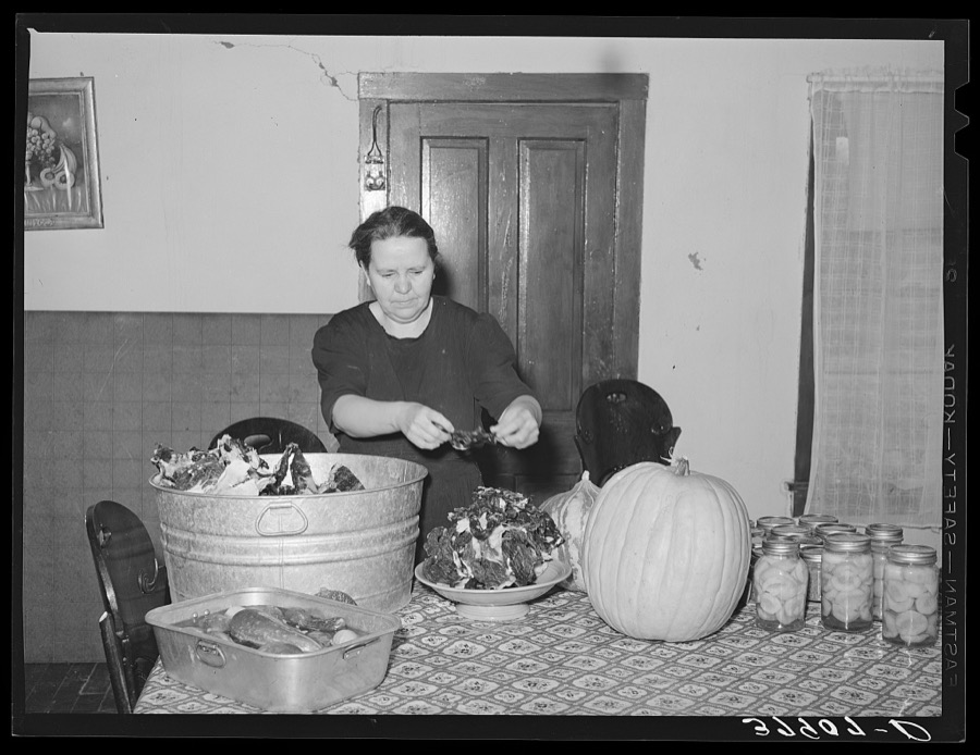 Woman of Spanish extraction putting up dried meat with other produce of the farm. Concho, Arizona