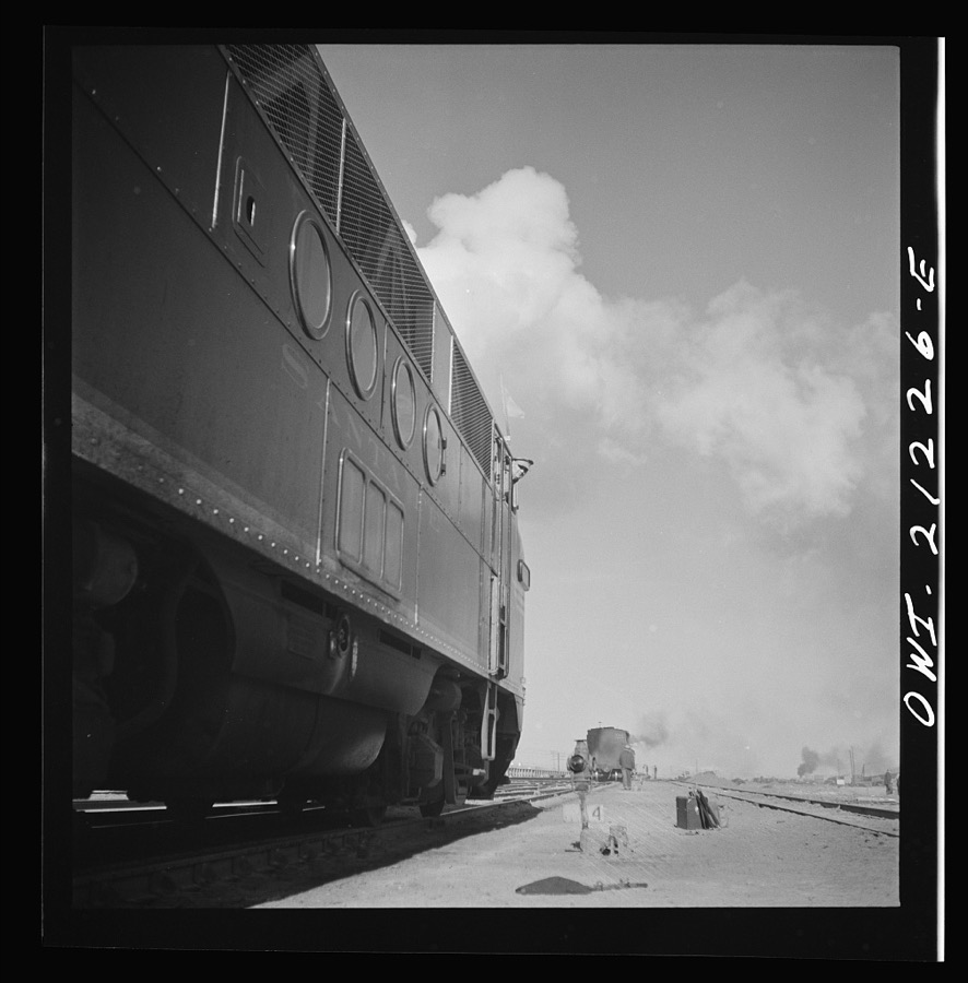 Winslow, Arizona. A diesel freight engine waiting to pull out of the Atchison, Topeka and Santa Fe Railroad yard