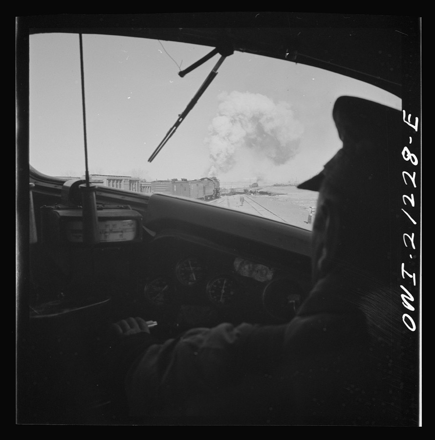 Winslow, Arizona. Looking through the windshield of a diesel freight engine pulling out of the Atchison, Topeka and Santa Fe Railroad yard
