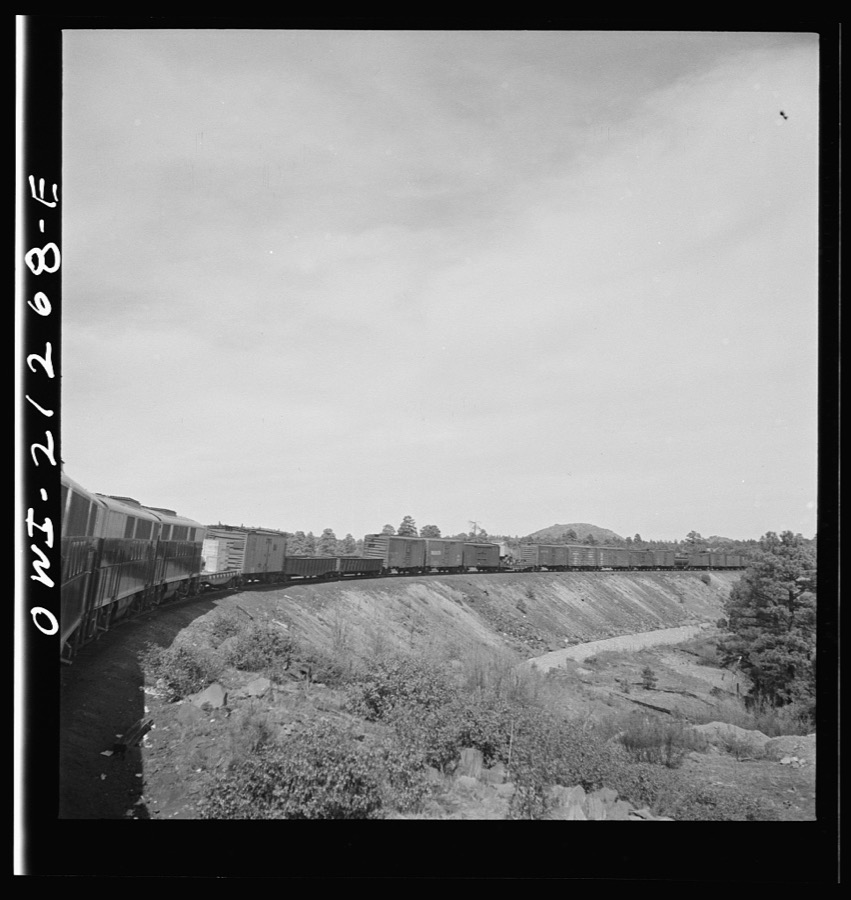 Williams, Arizona. A diesel freight train climbing through mountainous area along the Atchison, Topeka, and Santa Fe Railroad between Winslow and Seligman, Arizona