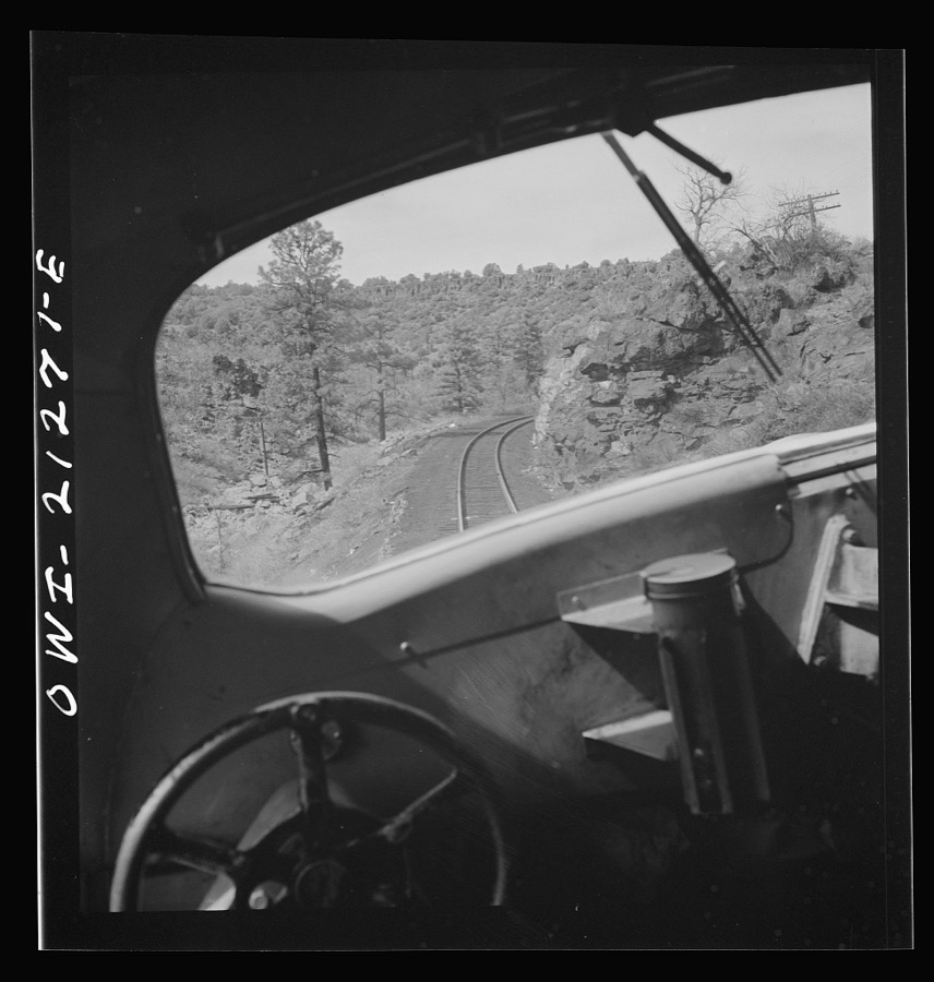 Williams, Arizona. On the Atchison, Topeka and Santa Fe Railroad between Winslow and Seligman, Arizona, going around a curve in the mountains