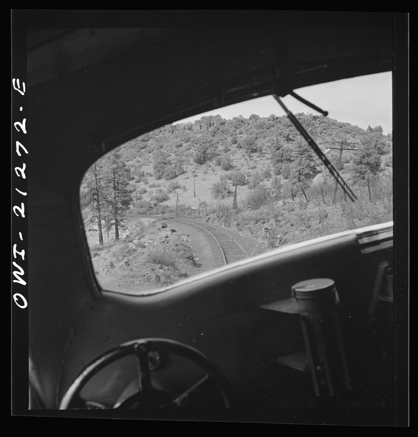 Williams, Arizona. On the Atchison, Topeka and Santa Fe Railroad between Winslow and Seligman, Arizona, going around a curve in the mountains
