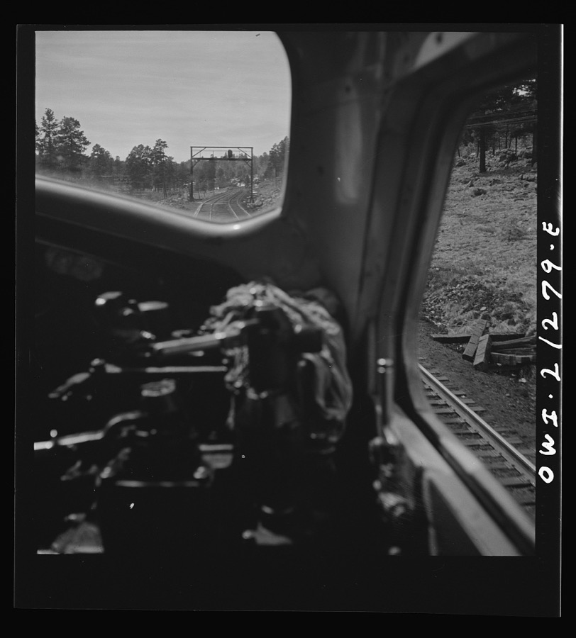 Williams (vicinity), Arizona. A diesel freight train on the Atchison, Topeka and Santa Fe Railroad between Winslow and Seligman, Arizona going through the mountains