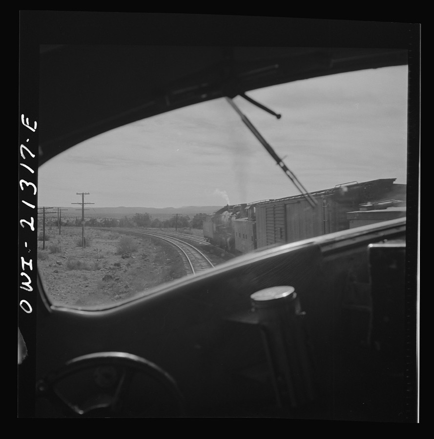Ash Fork (vicinity), Arizona. Passing an eastbound freight train on the Atchison, Topeka and Santa Fe Railroad between Winslow and Seligman, Arizona