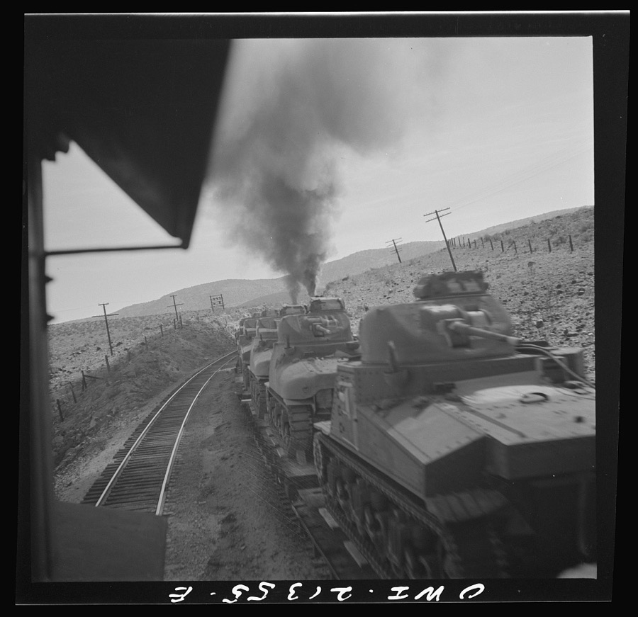 Nelson (vicinity), Arizona. Passing a train load of military tanks on the Atchison, Topeka and Santa Fe Railroad between Seligman, Arizona and Needles, California