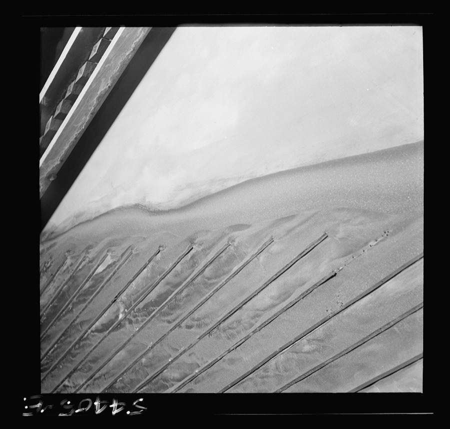 Kingman (vicinity), Arizona. Tungsten ore concentrating on tables in a recovery plant near the Boriana mine. There are many vital uses for this ore in the war effort