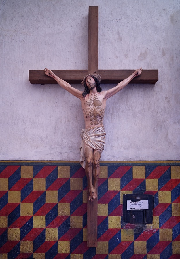 Sanctuary detail of Jesus on the cross within the Mission San Xavier del Bac, a Spanish Catholic mission, completed in 1797 on what is now the Tohono O'odham San Xavier Indian Reservation in Pima County, Arizona, just south of Tucson