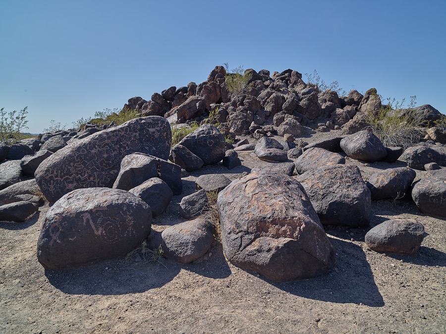 Rock carvings at the Painted Rocks petroglyph site, near the town of Theba in Maricopa County, Arizona. More than 800 images attributed to the Hohokam people have been found among weathered basalt boulders overlaying a granite outcrop in the area