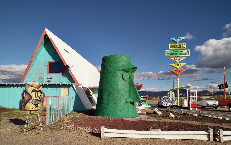 This green tiki head (right) and another figure, whatever it is, stand outside the gift shop of the old Ranchero Motel in the tiny settlement of Anteres, Arizona, in Mohave County along U.S. Highway 66
