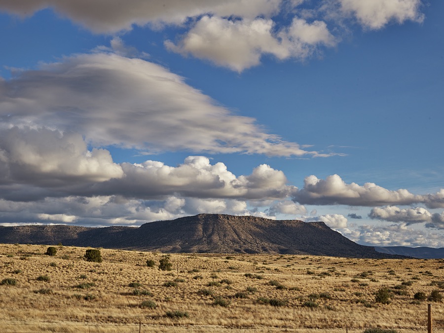 Scene along old U.S. highway 66 in Mohave County, Arizona. Much of Route 66, America's best-known historic highway, which was known as "the Mother Road," connecting Chicago, Illinois, and Santa Monica, California, in the heyday of cross-country family travel from the 1930s through th 50s, has been subsumed by the nation's high-speed interstate highways. But a bending portion of the old, two-lane highway that survives in western Arizona still draws curiosity-seekers and nostalgia buffs