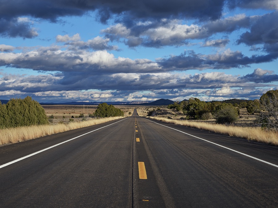 Stretches of old U.S. highway 66 such as this in Mohave County, Arizona, are often deserted. Much of Route 66, America's best-known historic highway, which was known as "the Mother Road," connecting Chicago, Illinois, and Santa Monica, California, in the heyday of cross-country family travel from the 1930s through th 50s, has been subsumed by the nation's high-speed interstate highways. But a bending portion of the old, two-lane highway that survives in western Arizona still draws curiosity-seekers and nostalgia buffs