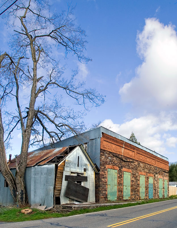 Photograph of Gamble Building and Miner's Bean Kettle