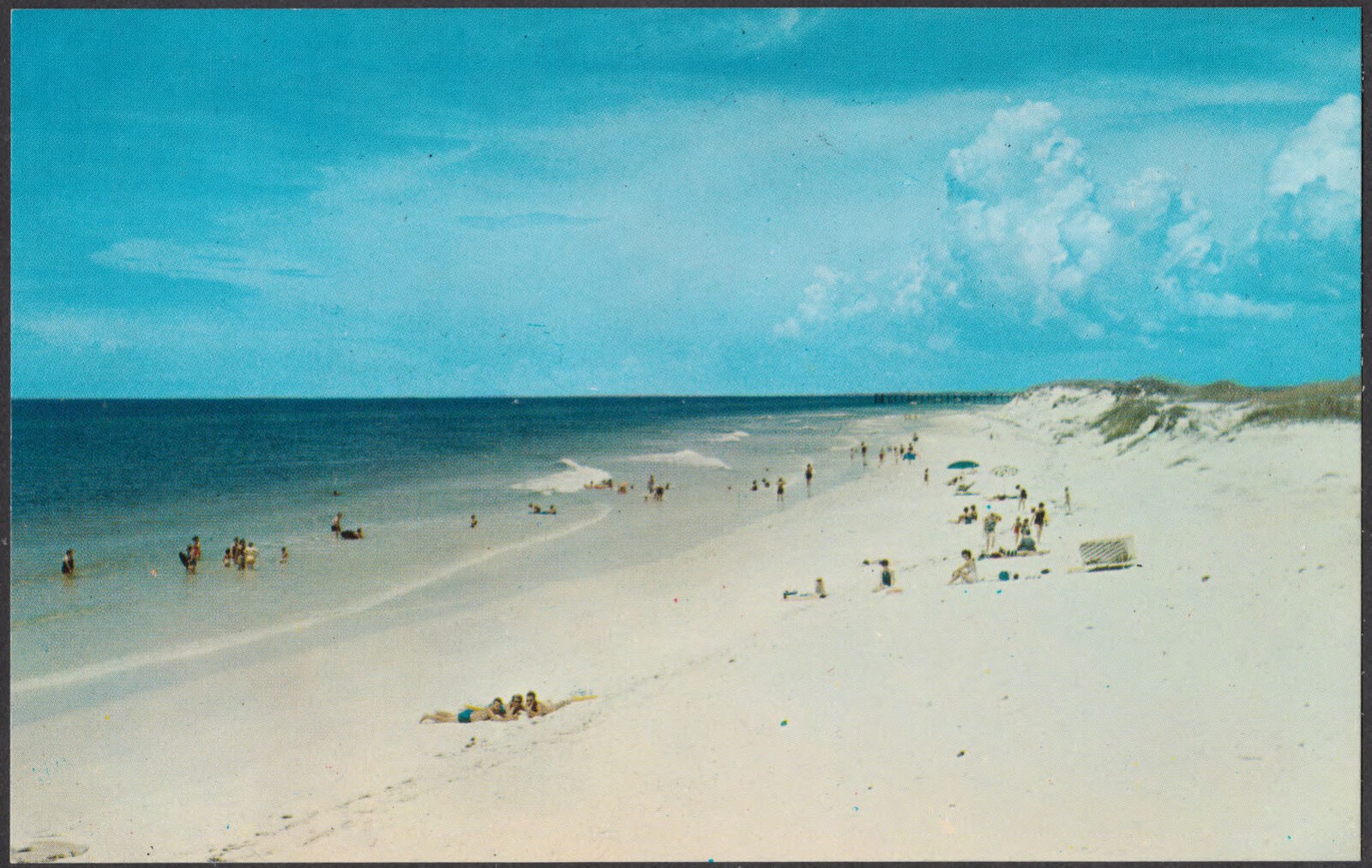 Miles of sugar-white sand meet the azure-blue waters of the Gulf of Mexico along north-west Florida's Miracle Strip, Boston Public Library - undated