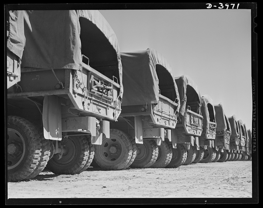 Fort Benning. Military trucks. Fast freighters of our motorized army. Uncle Sam's new military trucks can do jobs that would astonish even the famous American army mule. They serve as troop carriers or as supply and ammunition trains with the same high efficiency