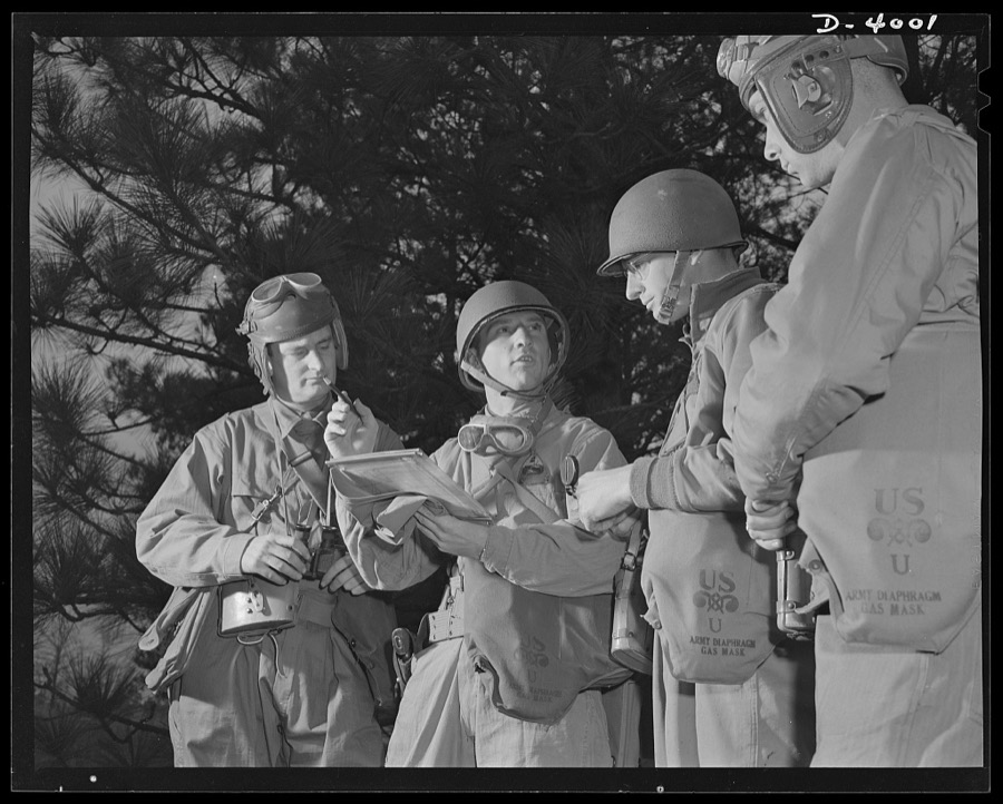 Fort Benning. Armored forces personnel. Council of the powers. A group of armored-forces officers work out a tactical problem and map a course of action that will broaden the training program at Fort Benning, Georgia