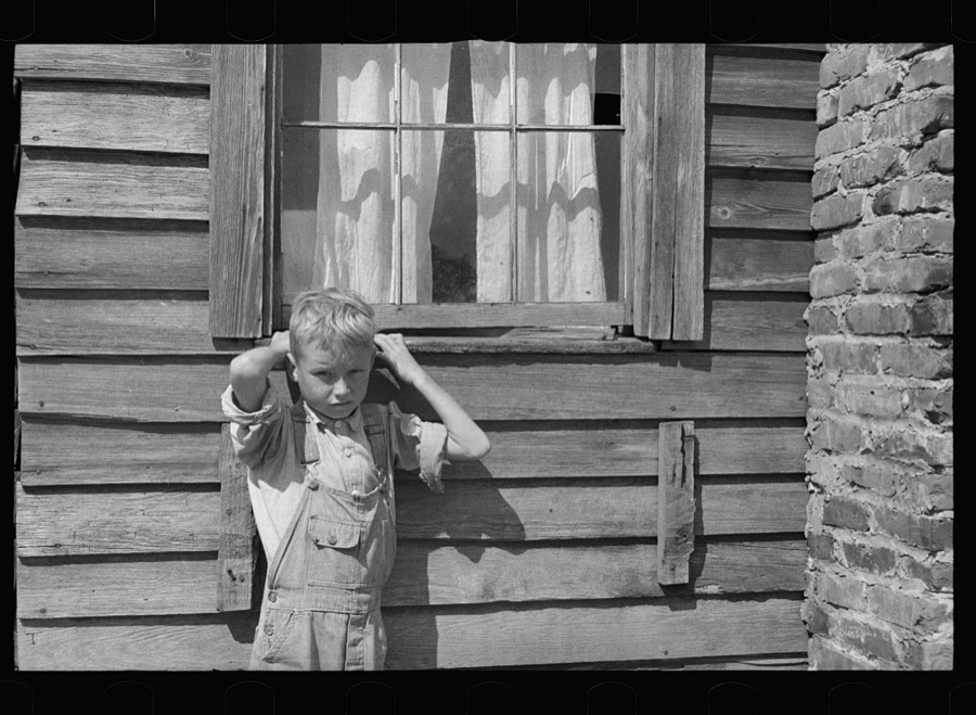 Son of a farmer on Wolf Creek Farms project who has not yet been moved to a new house, Wolf Creek Farms, Grady County, Georgia