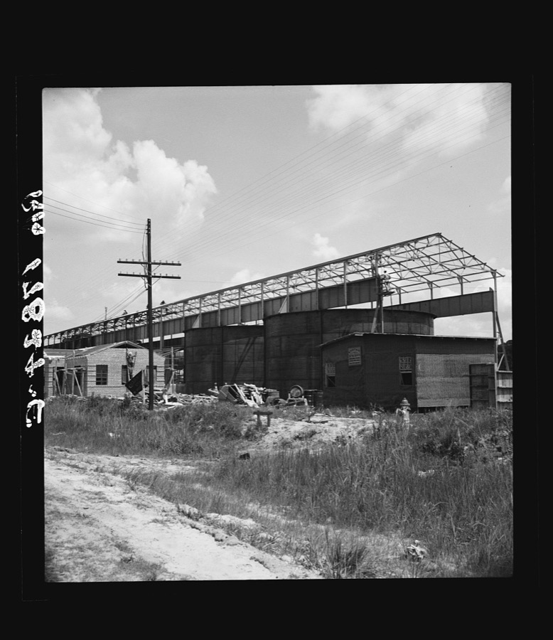 Large turpentine still and processing plant near Valdosta, Georgia. This represents industrialization of the turpentine process and forecasts the decline of small processors with their stills in the woods. Farmers will do their own chipping and dipping in the future and deliver the raw gum to the plants of this type. Now they lease their trees to the small processor