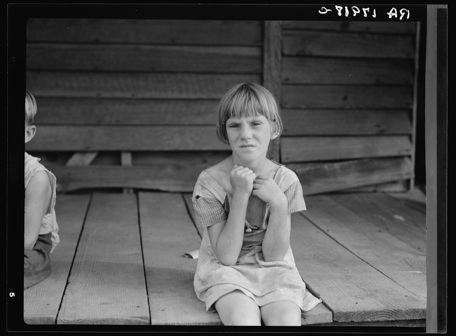 Sharecropper's child whose father receives five dollars a month "furnish" from the landowners. Macon County, Georgia