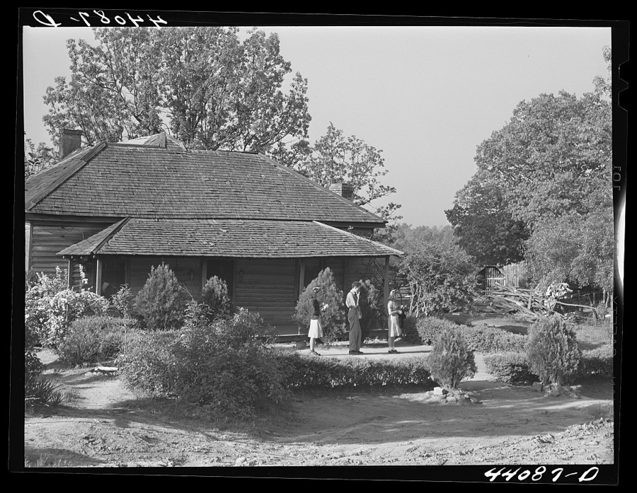 Three of the children of Lemuel Smith, FSA (Farm Security Administration) borrower, waiting outside their house for the school bus. Carroll County, Georgia