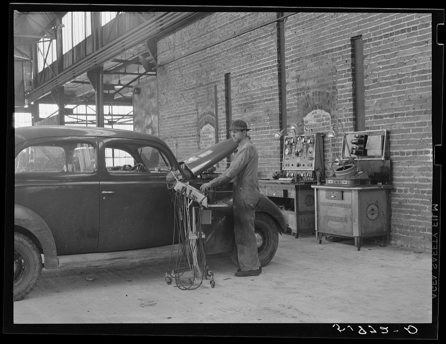 Testing motors of car in FSA (Farm Security Administration) warehouse depot. Atlanta, Georgia