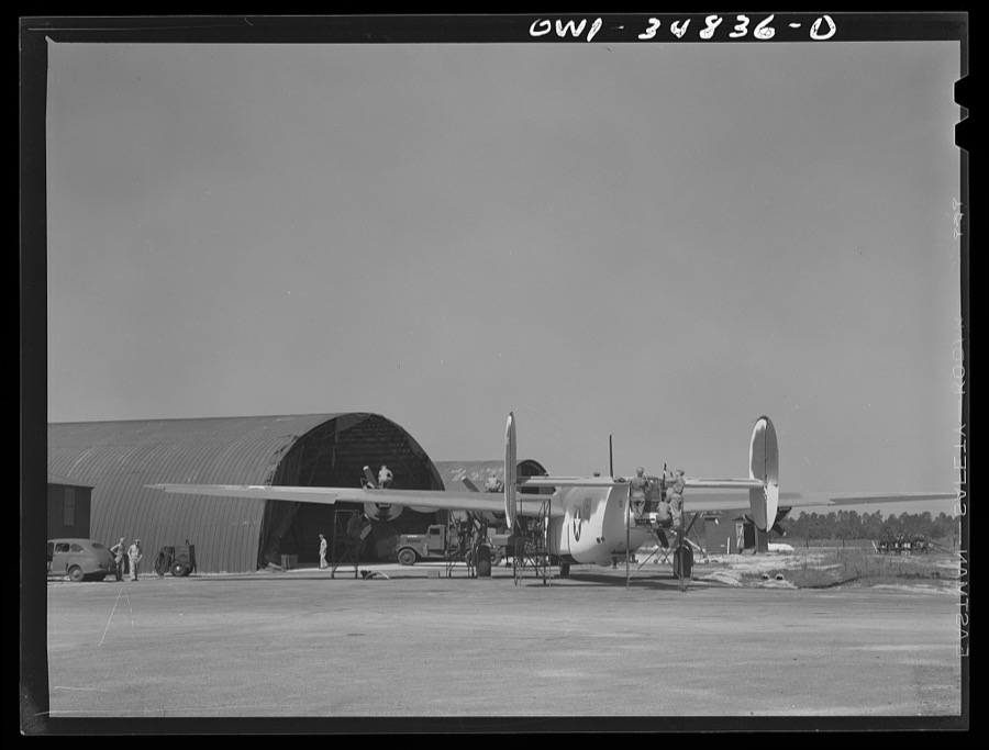 Warner Robins, Georgia. Air Service Command, Robins Field. A B-24 Liberator bomber being serviced at a hangar of an air depot group