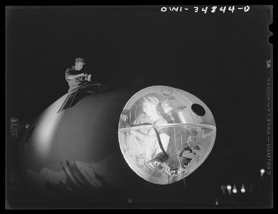 Warner Robins, Georgia. Air Service Command, Robins Field. Men of an air depot group working on a B-26 bomber at night