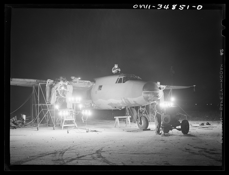 Warner Robins, Georgia. Air Service Command, Robins Field. Men of an air depot group working on a B-26 bomber at night