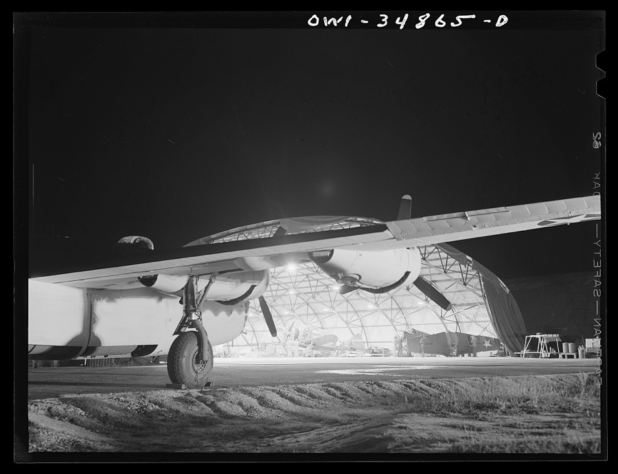 Warner Robins, Georgia. Air Service Command, Robins Field. Men of an air depot group working on a B-26 bomber at night