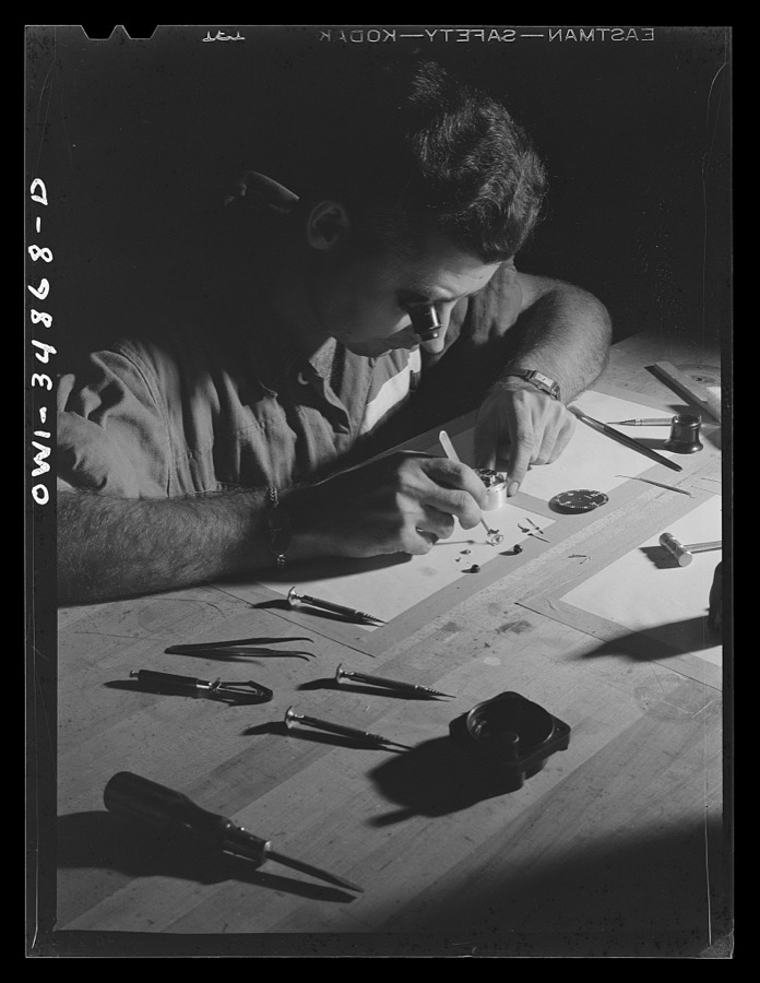 Warner Robins, Georgia. Air Service Command, Robins Field. Staff Sergeant C.A. Jones, an instrument repair man, working on an aircraft clock. Sergeant Jones comes from Lloyd, Florida