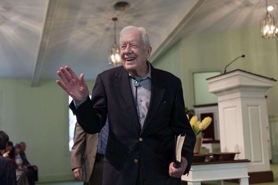 Ninety-two-year-old former U.S. president Jimmy Carter waves good-bye following his Sunday School lesson at the Maranantha Baptist Church in Carter's hometown of Plains, Georgia