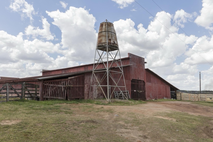 Barn and water tower near Plains in Sumter County, Georgia
