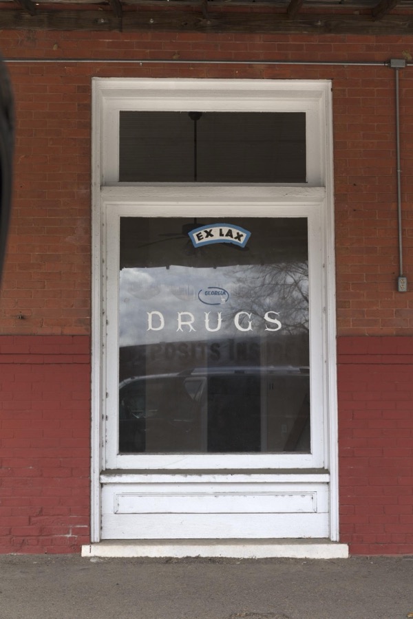 An old drug-store window, advertising the laxitive Ex-Lax, in the old cotton-mill town of Bartow in eastern Georgia