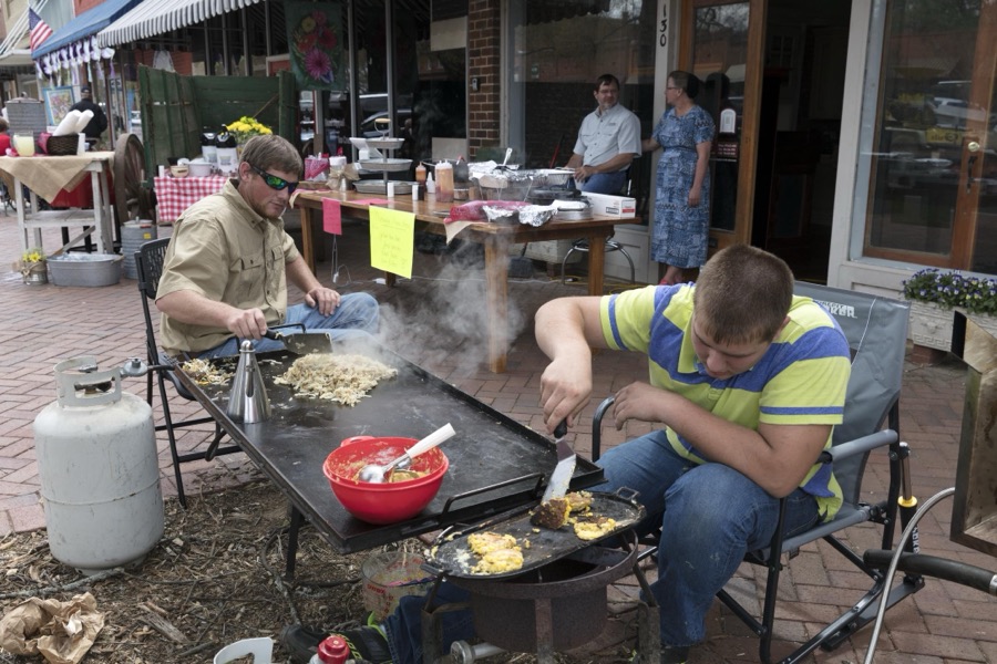 Kyler Giesbrecht, left, and Craig Holdeman cook at at the Louisville Heritage Day celebration in Louisville, a town in northeastern Georgia, named for French King Louis XVI in appreciation for French assistance to the colonists during the American Revolution