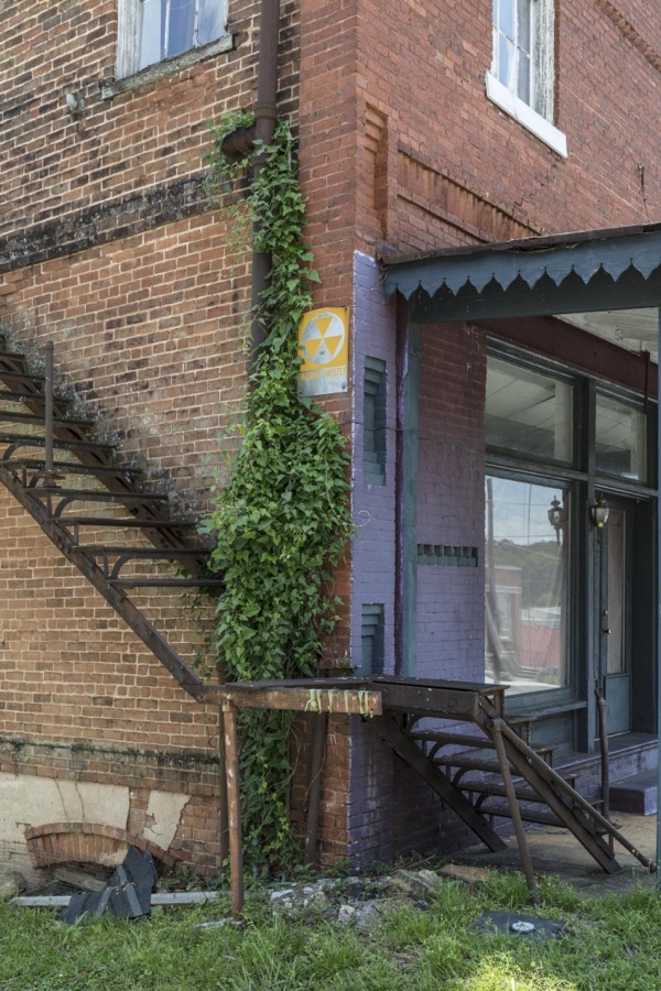 At first glance, the rusted-out staircase leading from the front porch of this old, abandoned building in Jefferson, Georgia, would seem to lead nowhere, to a five-foot dropoff or so, but upon closer examination, it connected the fire escape to the ground