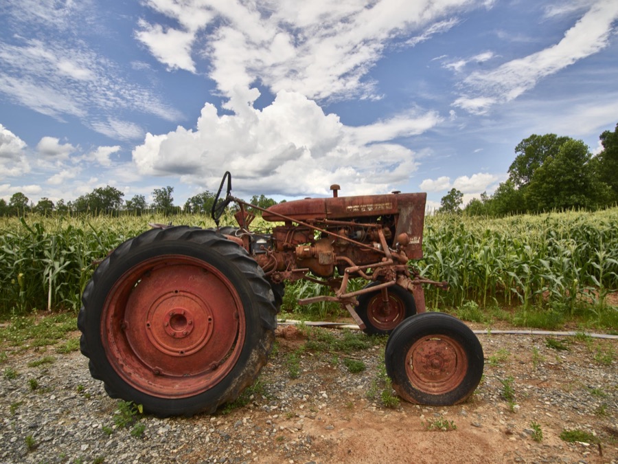 Vintage tractor beside a cornfield near Clarkesville in Habersham County, Georgia