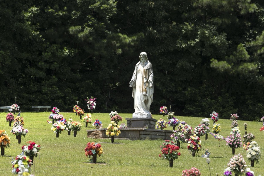 Small floral arrangements rather than headstones dot the Jackson Memorial Park cemetery in Commerce, Georgia