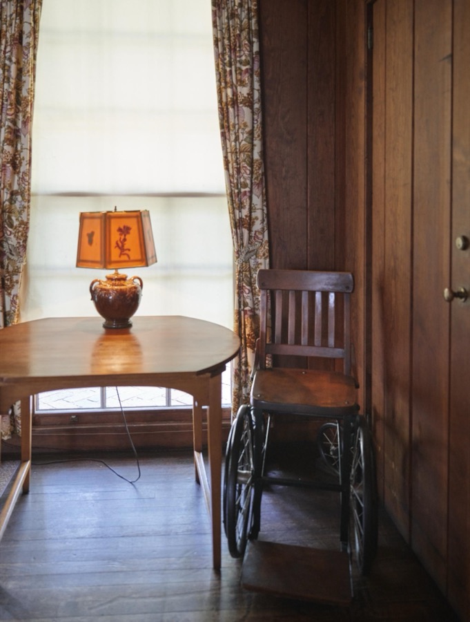 Franklin Roosevelt's wheelchair in a hallway at the "Little White House" in Warm Springs, Georgia, the town in which her husband, Franklin D. Roosevelt, sought treatment for polio in 1924, nine years before he became U.S. president