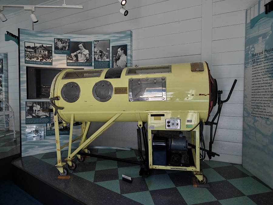 A tank ventilator, also known as an "iron lung," in the museum at the "Little White House," the residence of the United States' 35th president, Franklin Delano Roosevelt, on the grounds of the retreat and recuperation center where got rest, exercise, and treatment for infantile paralysis, or polio, in the site's naturally warm springs beginning in 1924 and continuing, off an on, until April 20, 1945, when he died suddenly there while still in office