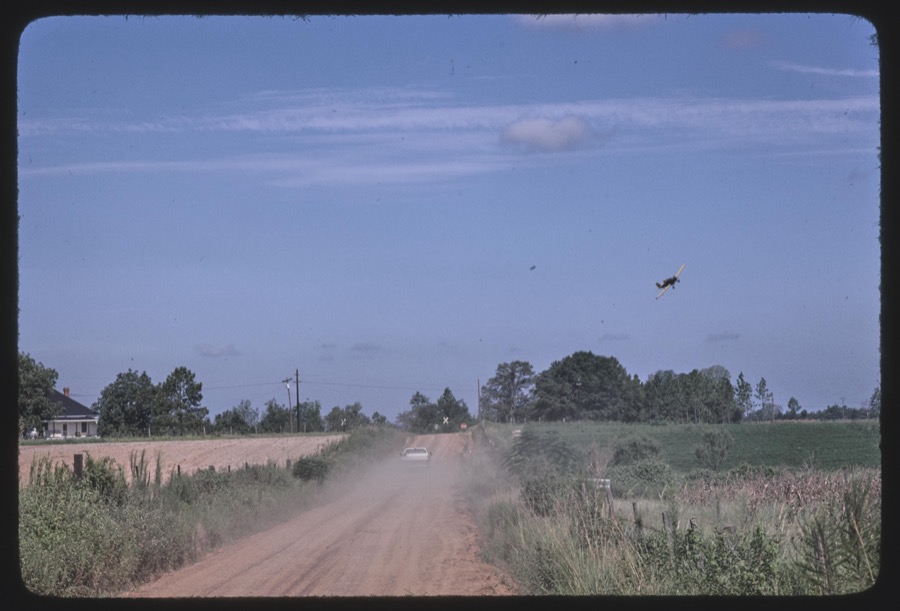 Crop dusting near Sycamore, Georgia; Luther "Lying" Bailey's peanut plants, Sycamore, Georgia
