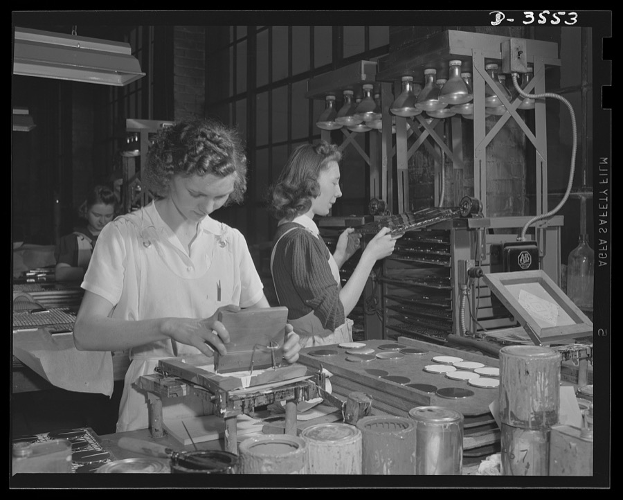 Conversion. Watch cases to war production. Compacts out, war production in. One of the last batches of luxury items is put through a Kentucky watch case plant now engaged in the production of gun parts, fuse baffles, compass cases and other essentials for our fighters. Wadsworth Watch Company, Louisville, Kentucky